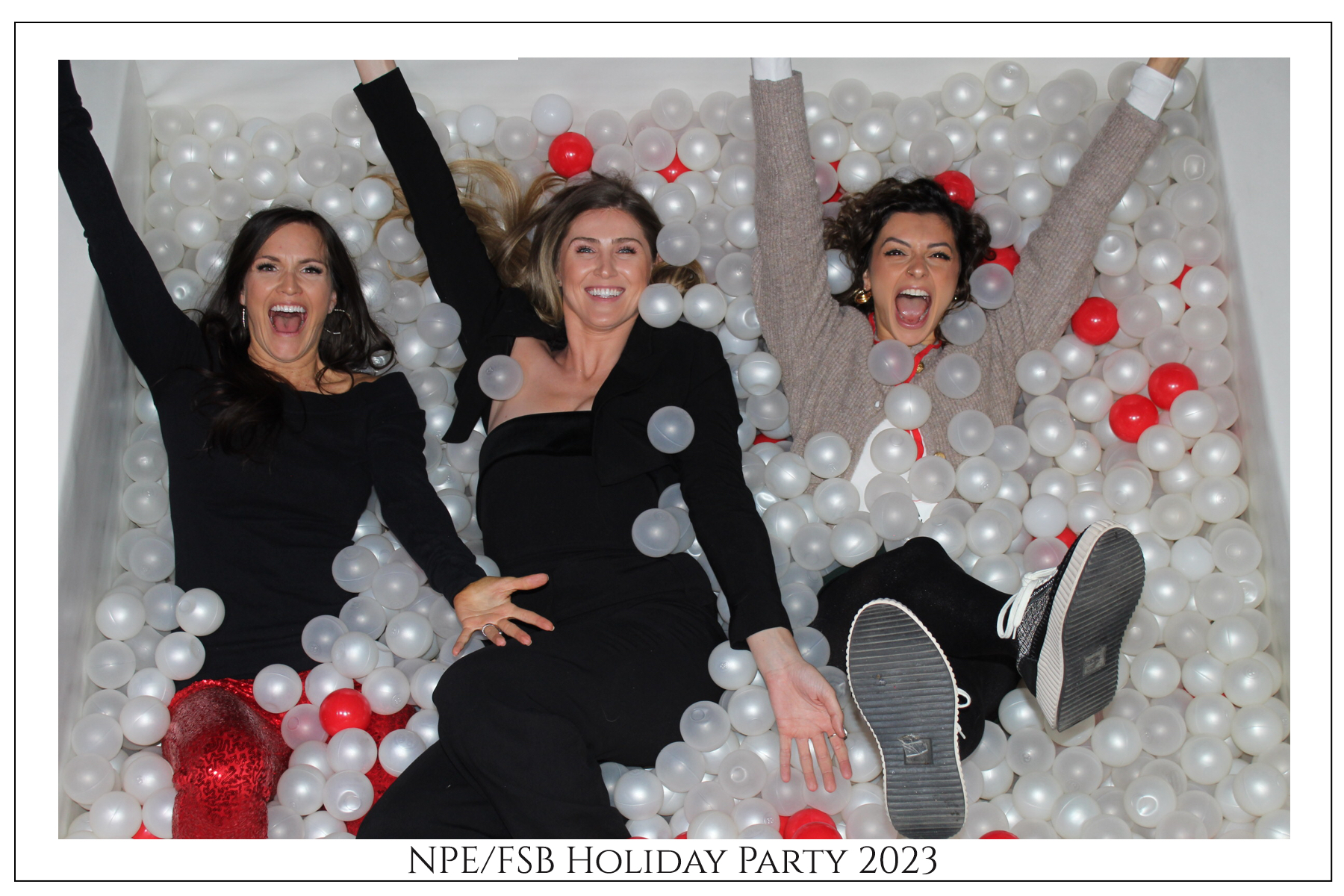 Guests laughing in the ball pit