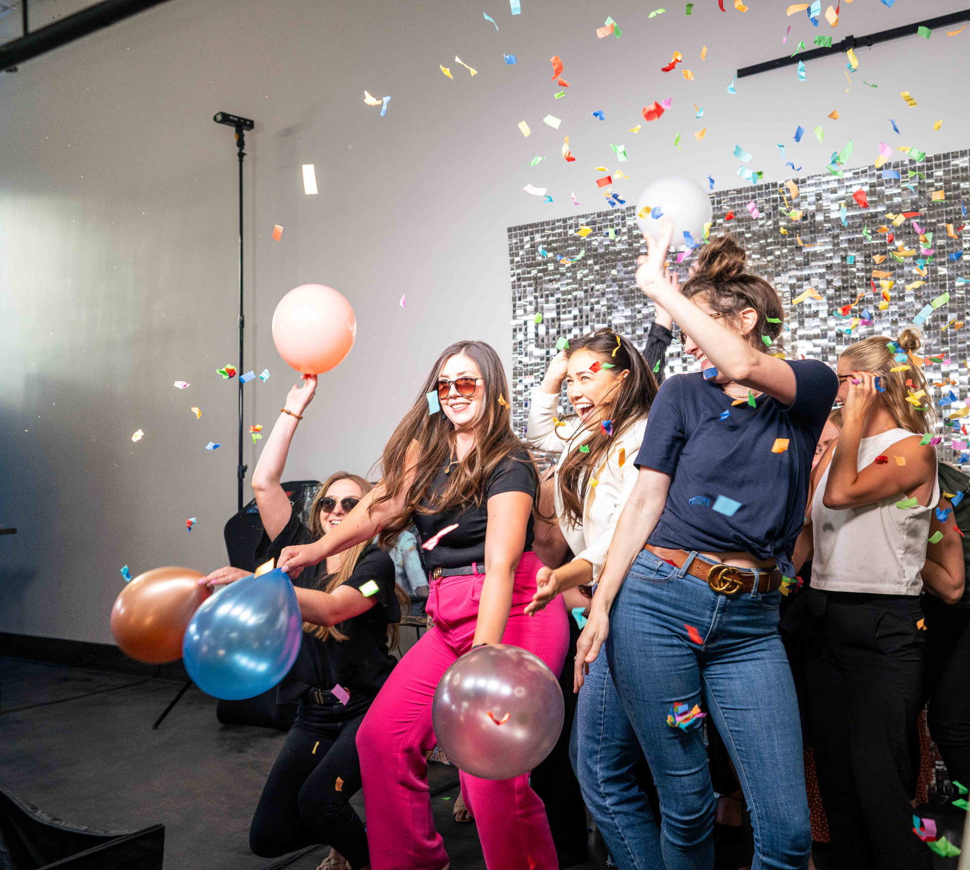 Guests celebrating with confetti and balloons