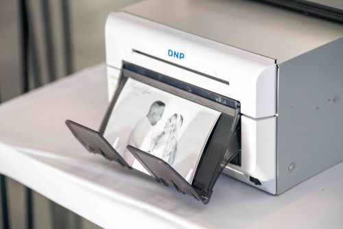 DNP photo printer producing elegant black-and-white wedding keepsake prints