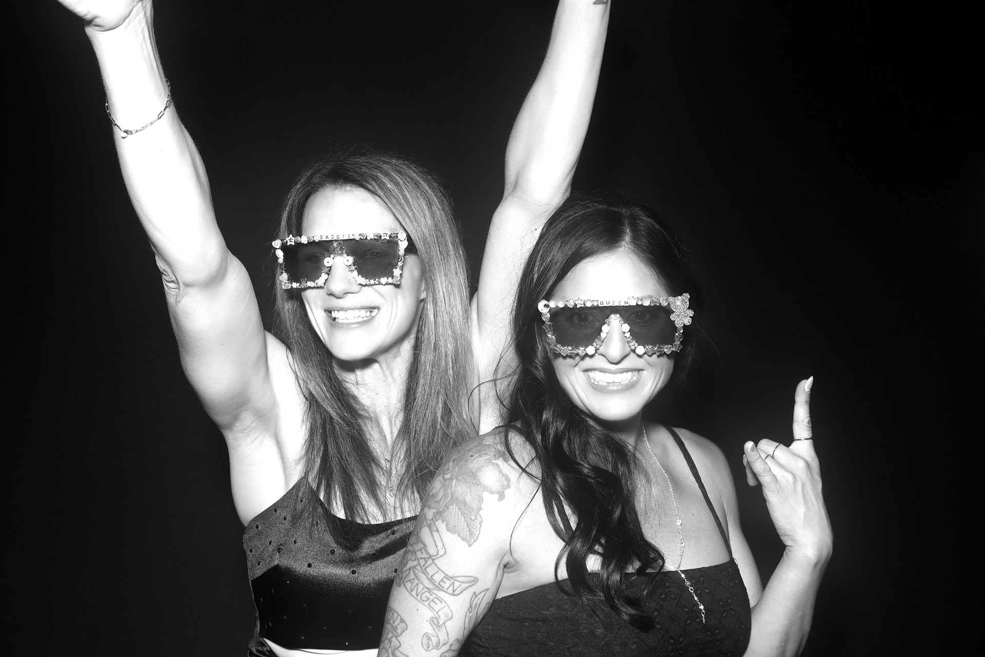 Black-and-white glam shot of two friends
