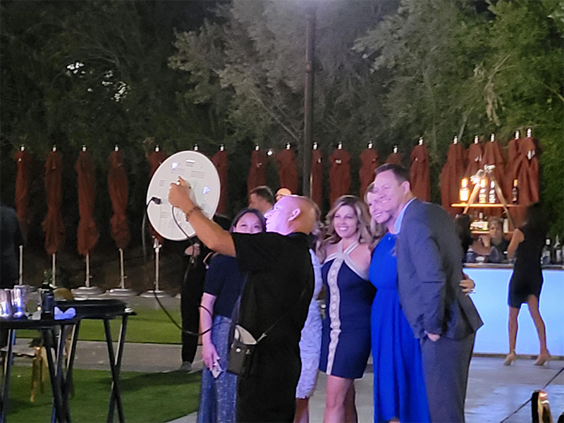 Roaming photo booth capturing guests at an outdoor event