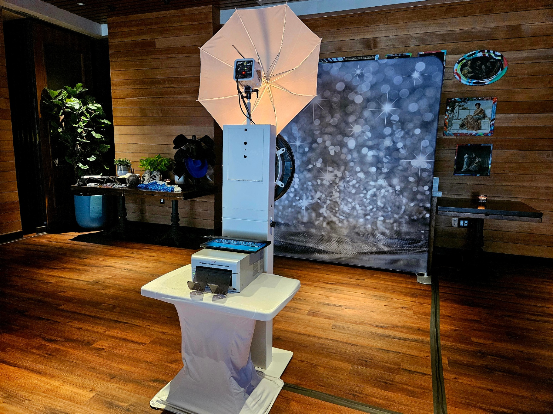 Photo booth with silver sparkle backdrop
