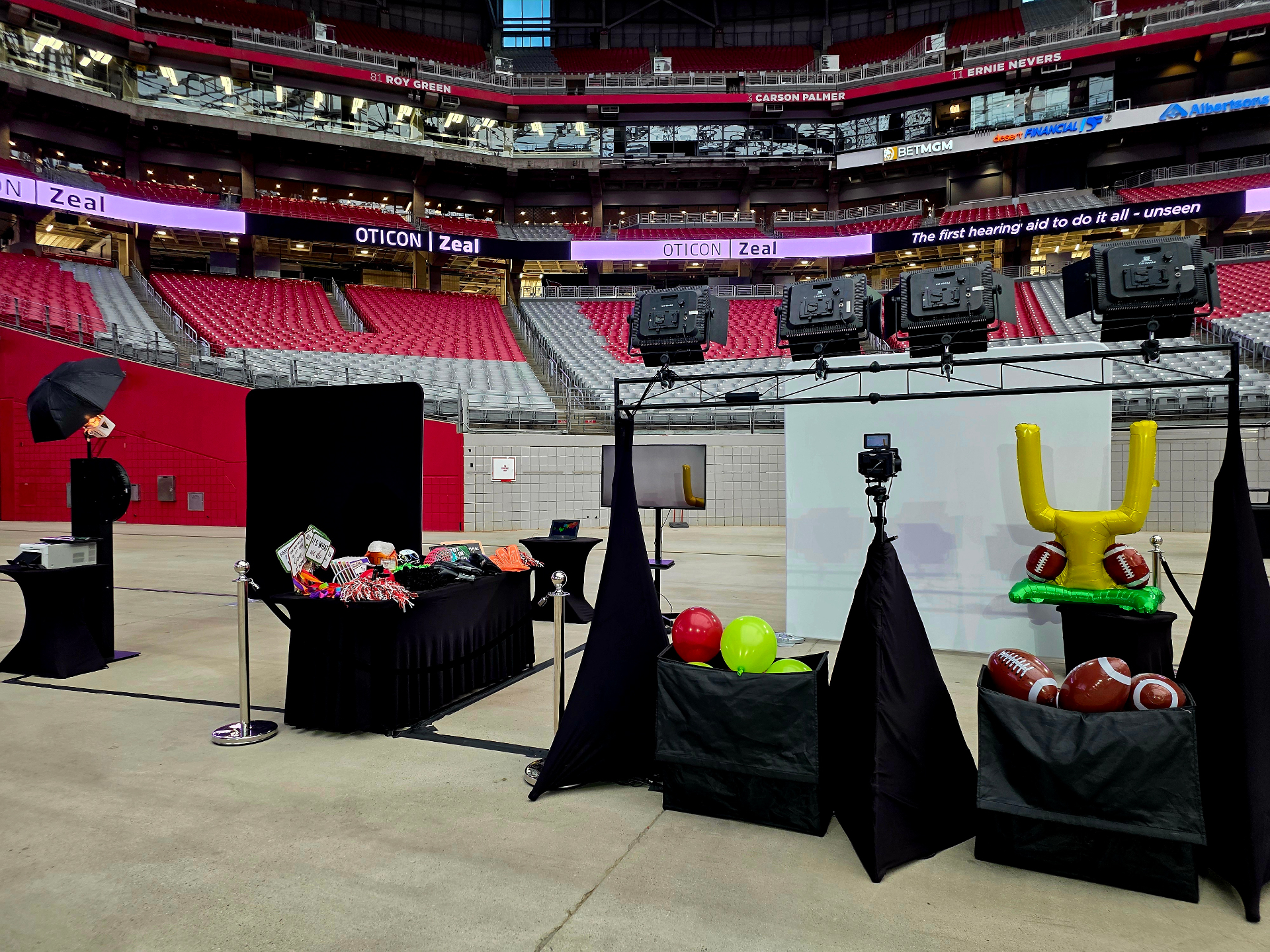 Football-themed photo booth setup at State Farm Stadium