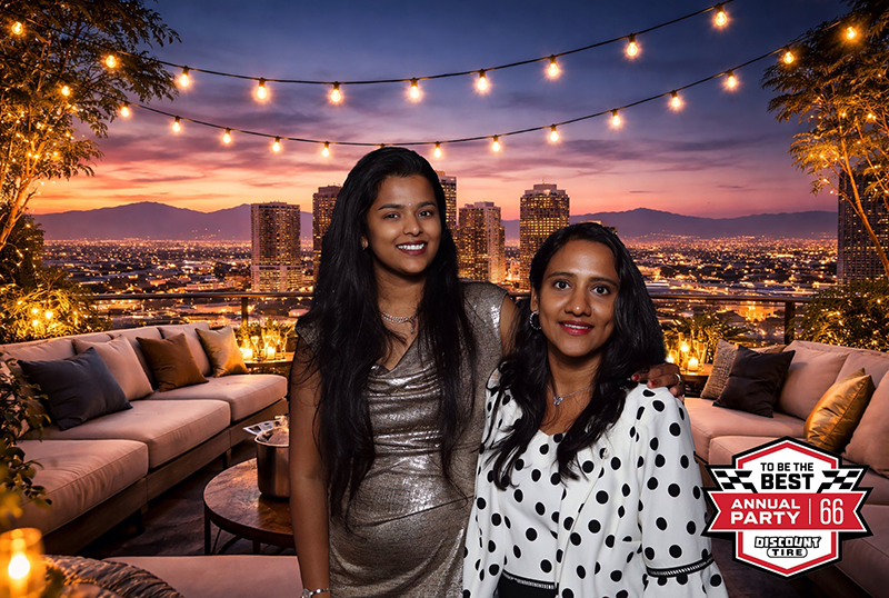 Discount Tire Annual Party photo booth print with city skyline backdrop
