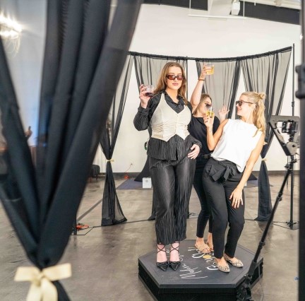Guests posing on a 360 video platform